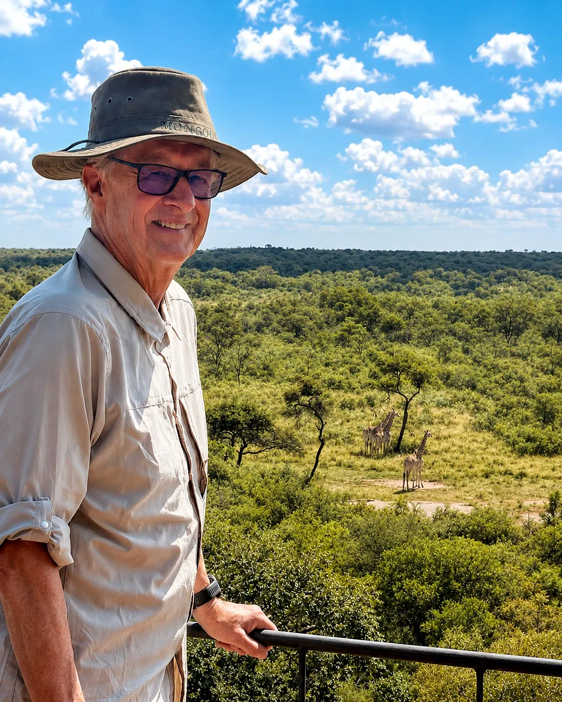 A guest at a lookout rail gazing out over the reserve