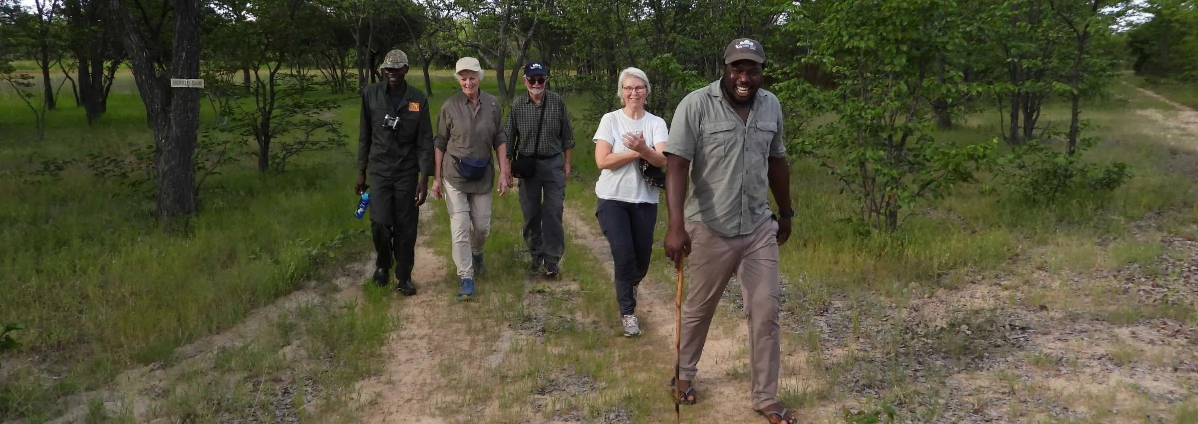 Guests walking with the Khami scouts through the bush